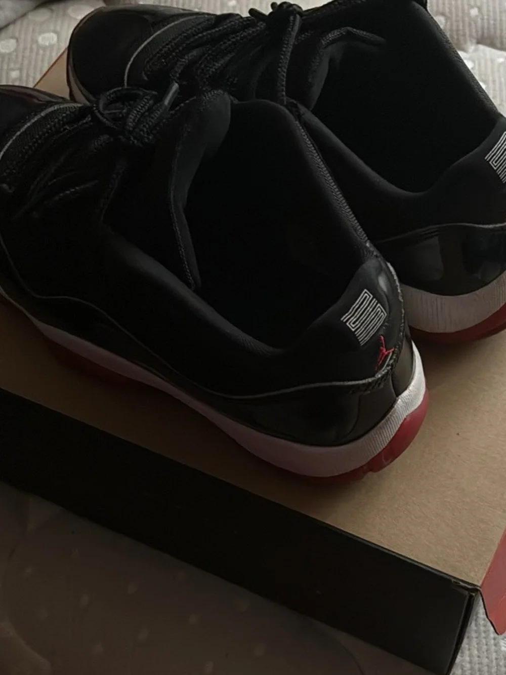 Black & Red Men’s Low-Top Jordan's 11 Athletic Sneakers